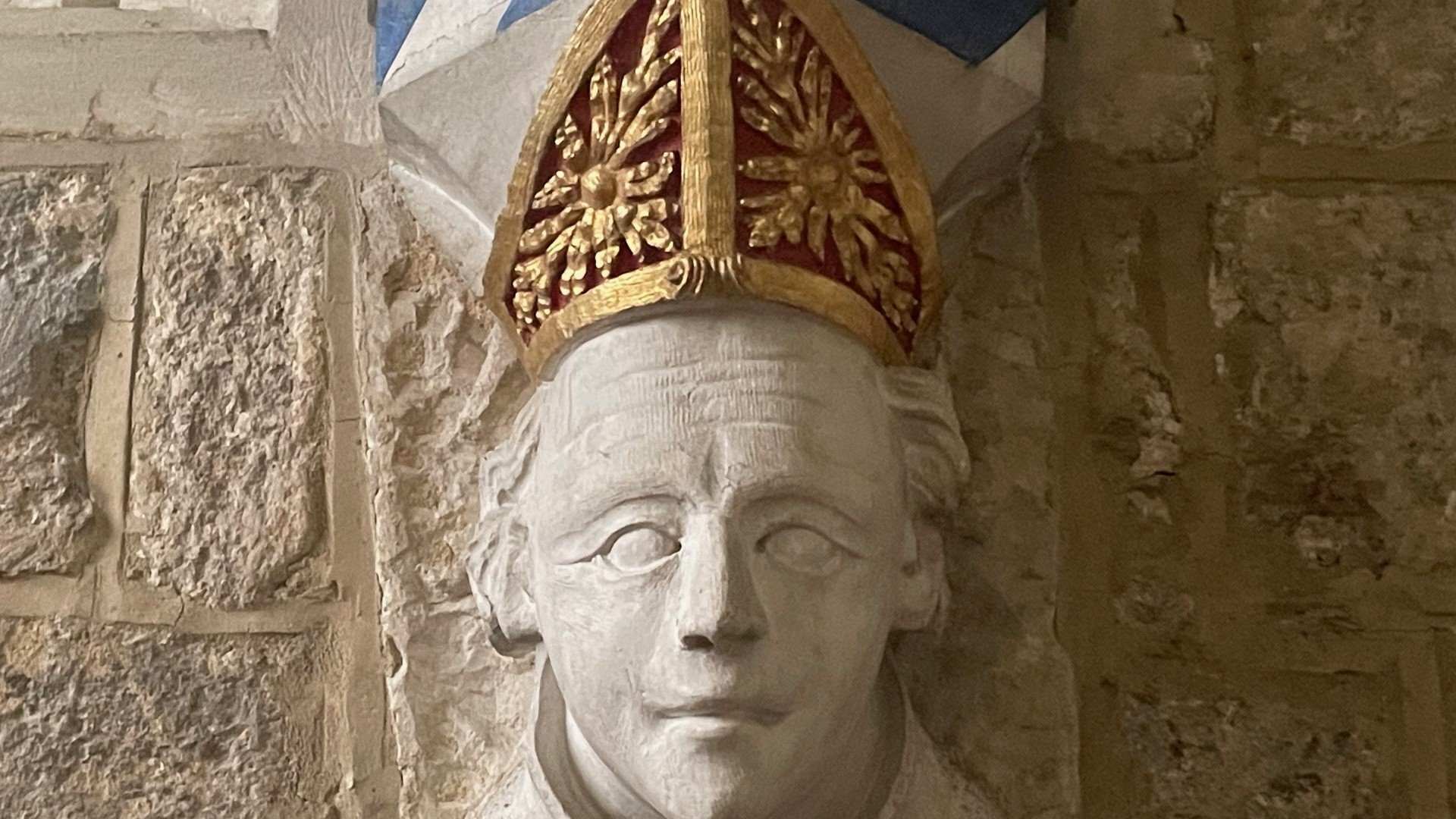 A carving of the face of Bishop Grandisson in the Lady Chapel at Ottery St Mary Parish Church