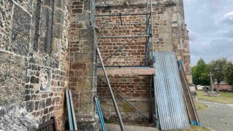 A picture of exterior scaffolding at Ottery Church for the major wiring and lighting project
