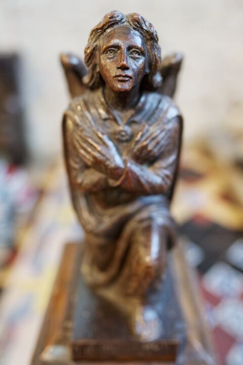 A close up of the face of an altar angel in Ottery St Mary church