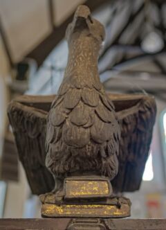 A view of the front of the eagle lectern in Alfington church