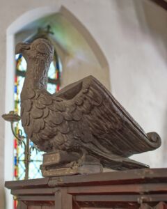 A view of the side of the eagle lectern in Alfington church