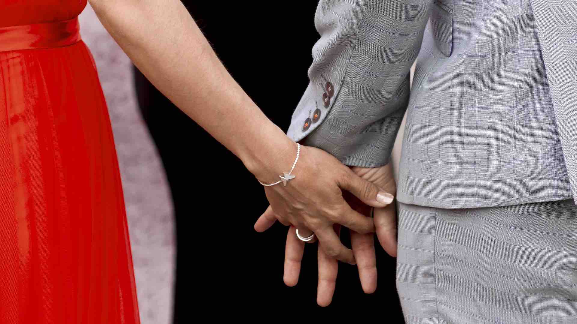 A married couple entering church to have their wedding vows blessed