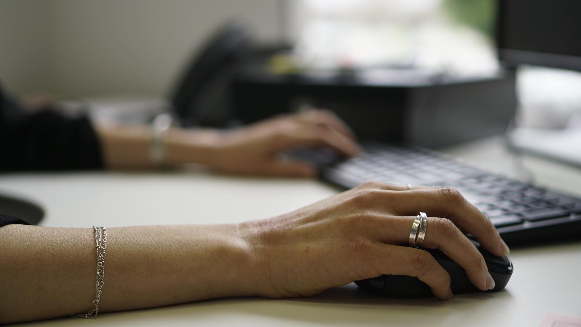 Person typing a message on a computer