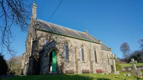 A view of the south-side of Escot church from the west of the churchyard