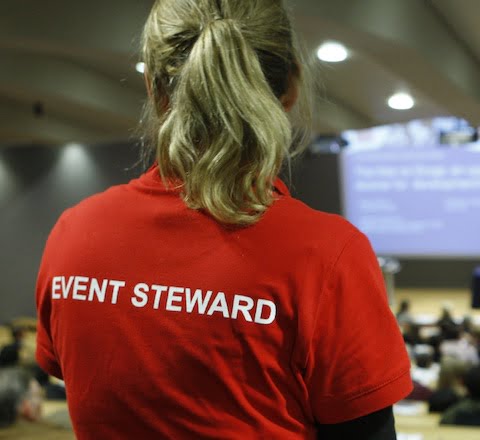 A steward helping at an event