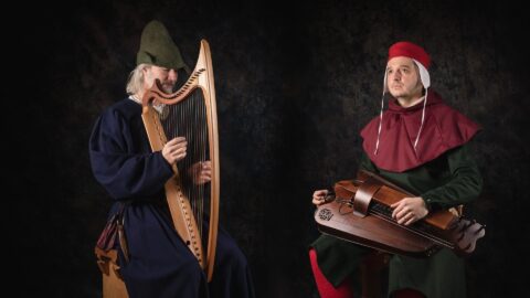A picture of two musicians, Marco Canavo and Steve Tyler, in Medieval costume