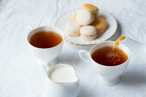 Tea and cakes being served at an event