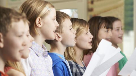 A group Of School Children Singing In the church Choir