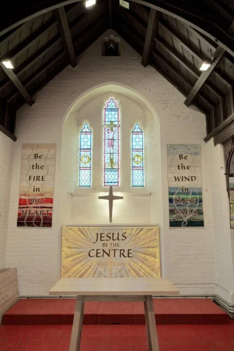 A view of the altar and east window at Newton Poppleford church