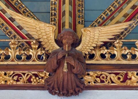 A view of one of the carved angels playing a flute at Payhembury church