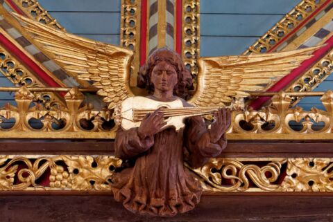 A view of one of the carved angels playing a mandolin at Payhembury church