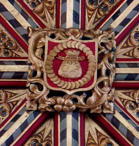 A view of one of the ceiling bosses in Payhembury church depicting Judas' thirty pieces of silver