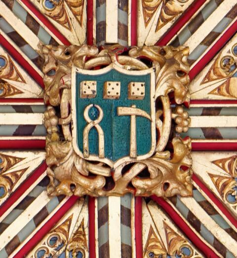 A view of one of the ceiling bosses in Payhembury church depicting the soldiers' crucifixion equipment