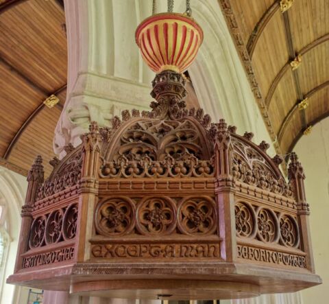 A view of the ornate carved wooden font lid at Payhembury church