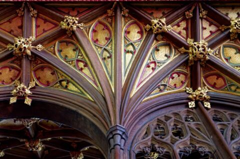 A close up view of the column and arches on the carved wooded screen at Payhembury church