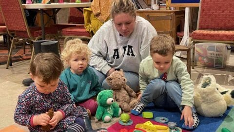 Children enjoying a teddy bears' picnic at Ottery Church's Teddies & Trains morning