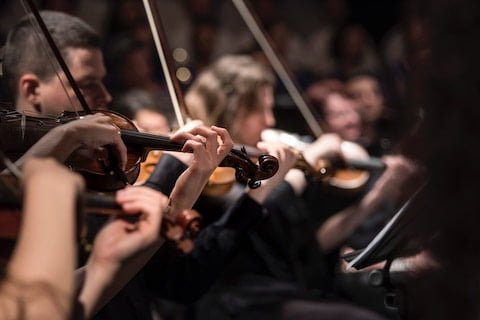 A photo of an orchestra giving a performance in church