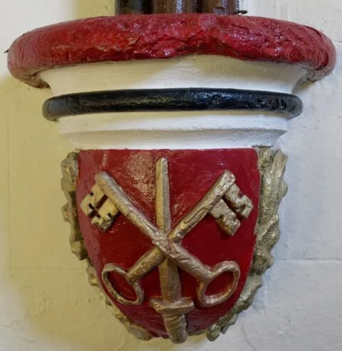 A view of a decorated stone capitals in Tipton St John church