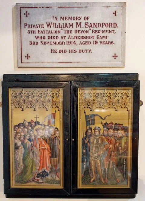 The stone plaque and finely painted panels in West Hill church dedicated to William Sanford who died in World War One