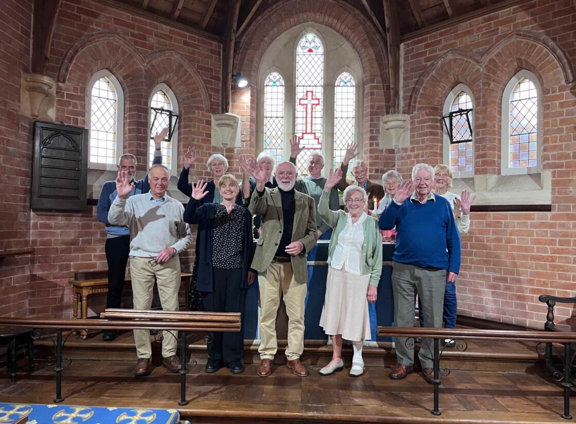 A photo of the congregation at Wiggaton church waving